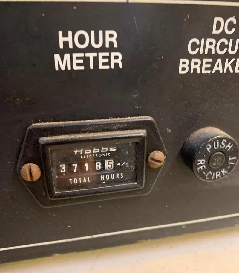 Slide: The Image of Hour meter and DC circuit breaker on 1989 Carver Californian 48 boat. - 25