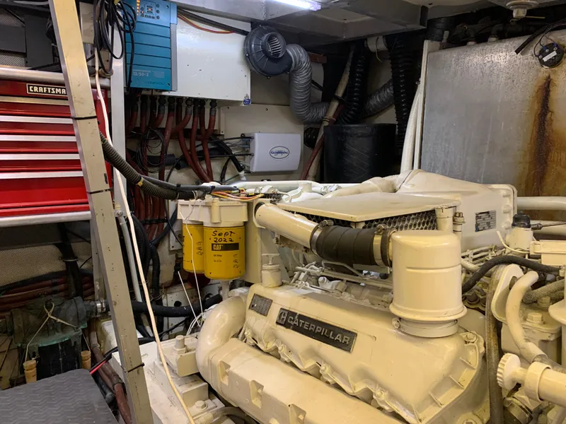 Slide: The Image of Engine room of 1989 Carver Californian 48 yacht with Caterpillar engine and tools. - 37