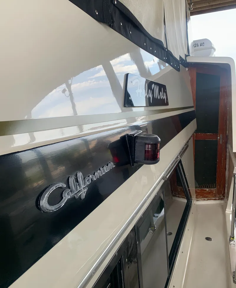 Slide: The Image of 1989 Carver Californian 48 yacht exterior with sleek design and elegant detailing. - 18