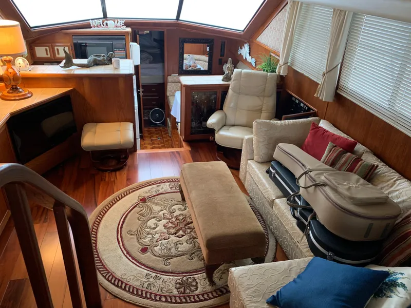 Slide: The Image of Interior of 1989 Carver Californian 48 yacht with cozy seating and elegant decor. - 21