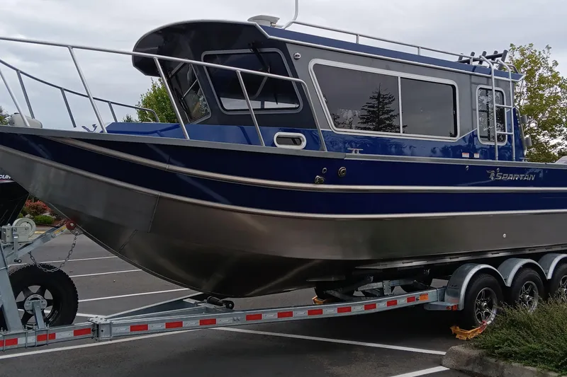 The Image of 2025 Spartan 2800 Olympia boat on trailer in parking lot. - 0