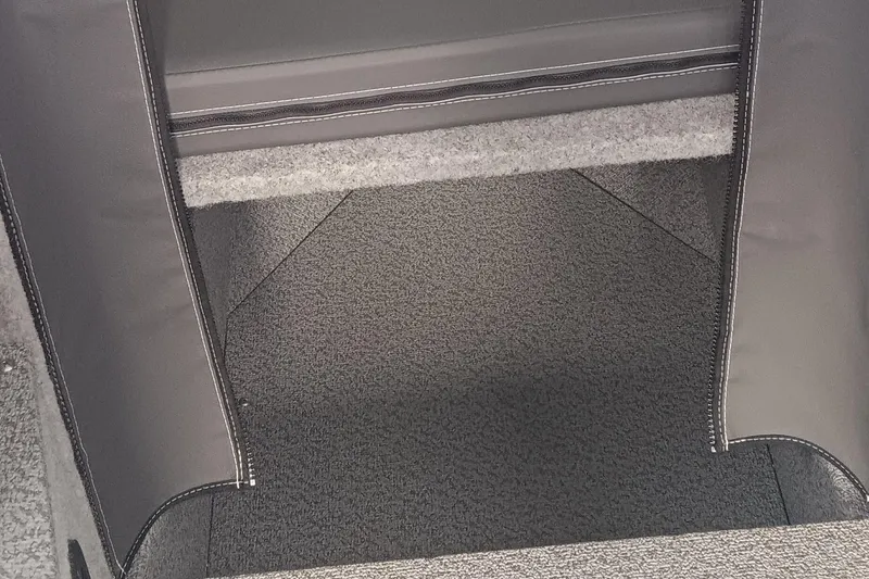 Slide: The Image of 2025 Spartan 2800 Olympia interior storage compartment with gray upholstery. - 10