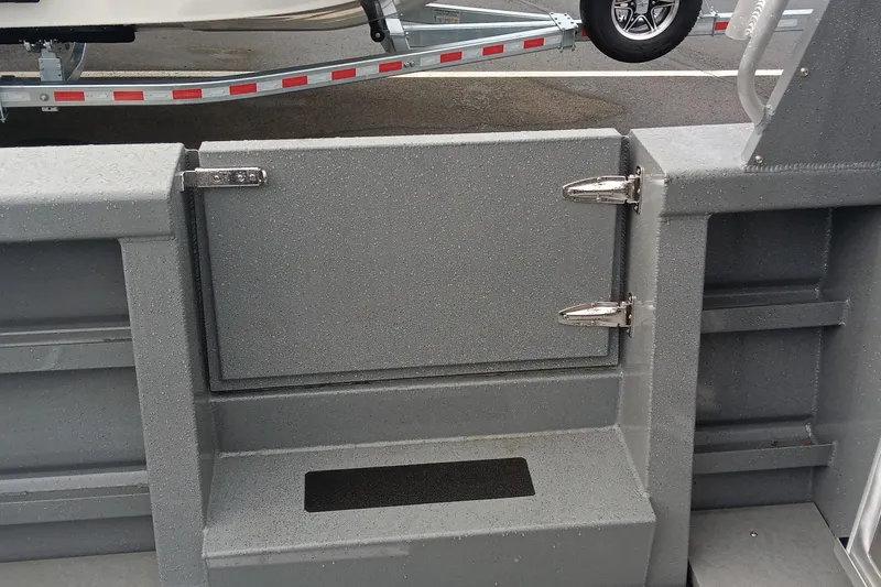 Slide: The Image of 2025 Spartan 2800 Olympia boat interior with gray textured finish and metal hinges. - 4