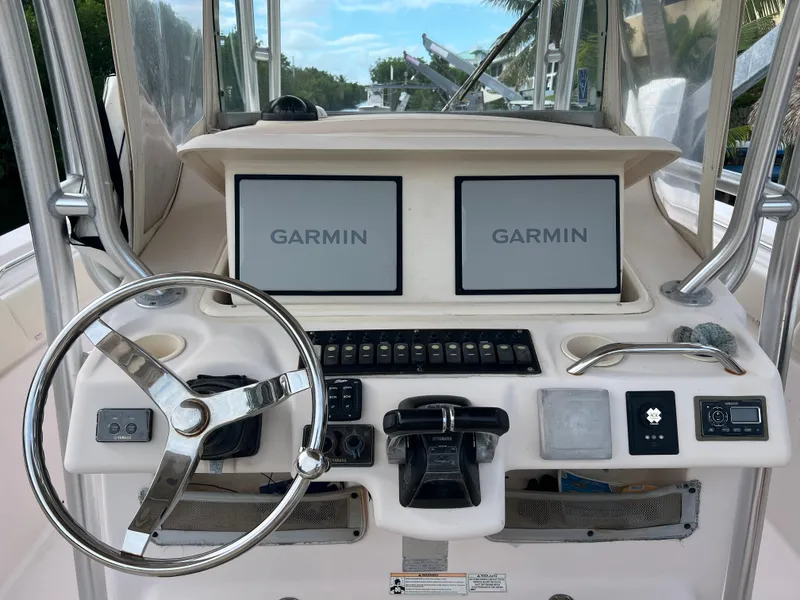 Slide: The Image of Grady-White Canyon 306 boat dashboard with dual Garmin displays, 2011 model. - 11