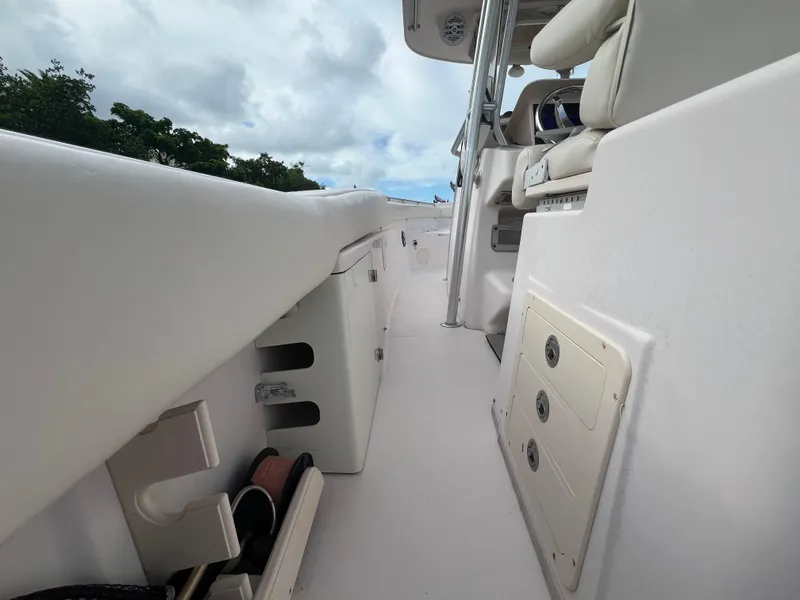 Slide: The Image of 2011 Grady-White Canyon 306 boat deck with seating and storage compartments. - 15