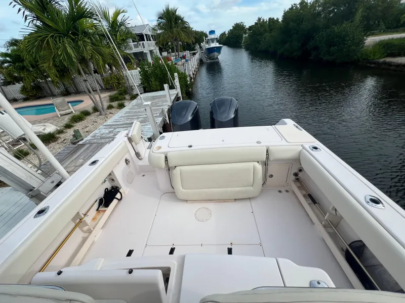 Slide: The Image of 2011 Grady-White Canyon 306 boat docked by a scenic canal. - 6