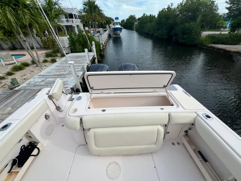 Slide: The Image of 2011 Grady-White Canyon 306 boat docked by a scenic canal. - 7