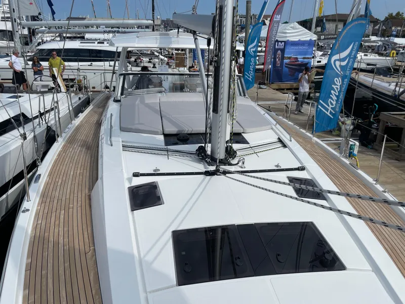 Slide: The Image of 2023 Hanse 460 yacht displayed at a boat show, featuring sleek design and modern amenities. - 4