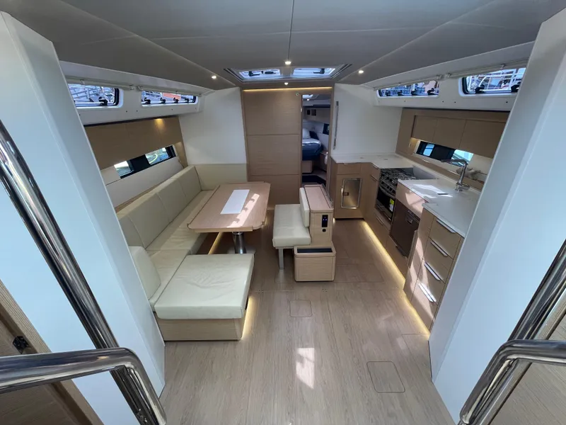 Slide: The Image of Modern interior of 2023 Hanse 460 yacht with sleek kitchen and dining area. - 7