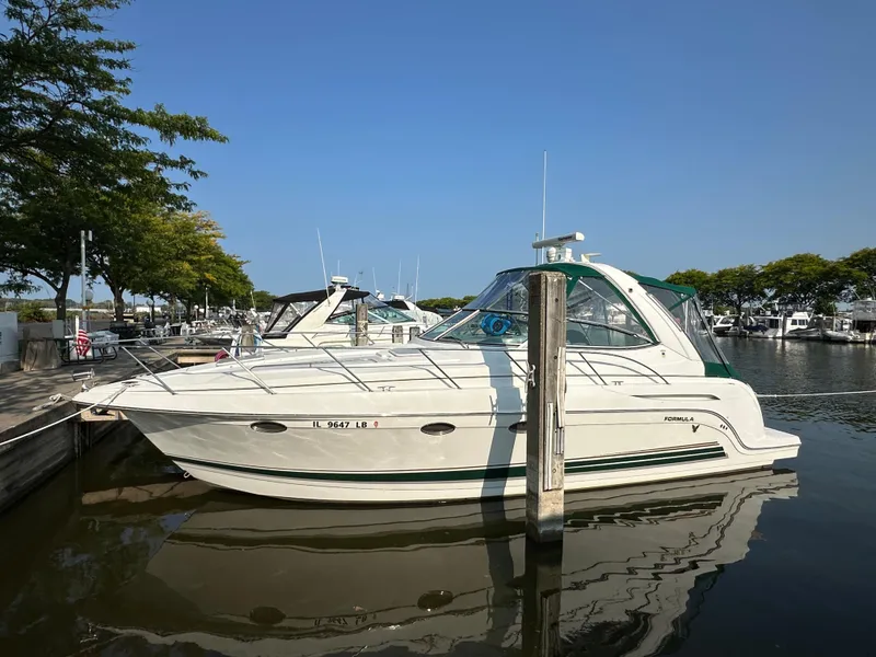 The Image of 2004 Formula 34 PC boat docked in a marina on a sunny day. - 0