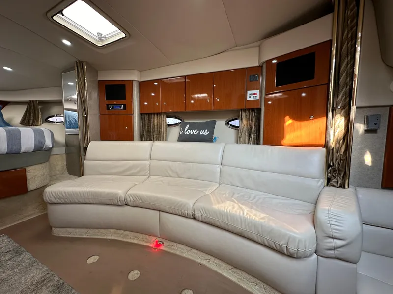 Slide: The Image of Luxurious interior of a 2004 Formula 34 PC yacht with cozy seating and elegant decor. - 14