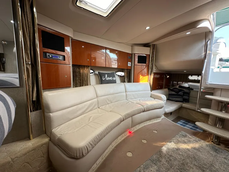 Slide: The Image of 2004 Formula 34 PC yacht interior with curved leather sofa and wood cabinetry. - 15