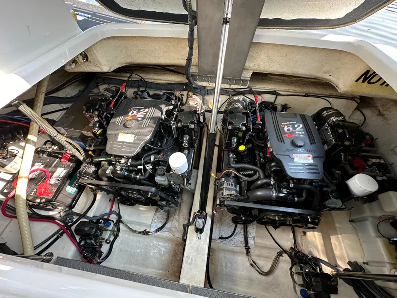 Slide: The Image of 2004 Formula 34 PC boat engine compartment with open hatch, revealing dual engines. - 28