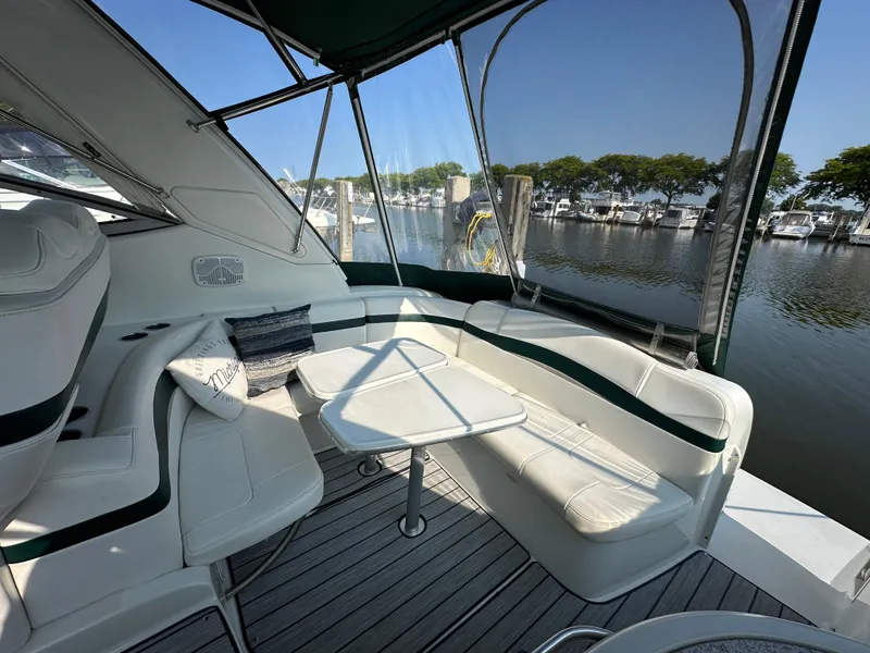 Slide: The Image of 2004 Formula 34 Performance Cruiser docked at marina, featuring sleek deck design. - 3