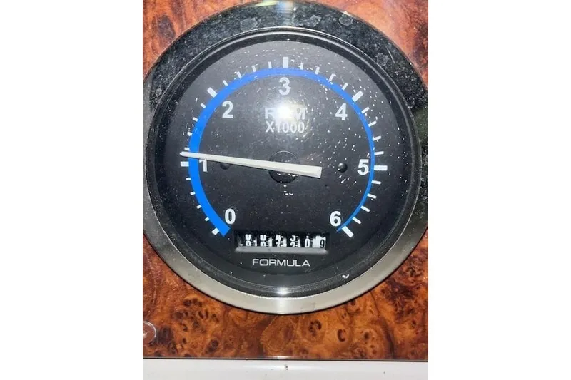 Slide: The Image of Tachometer of 2004 Formula 34 Performance Cruiser, displaying RPM and odometer readings. - 36
