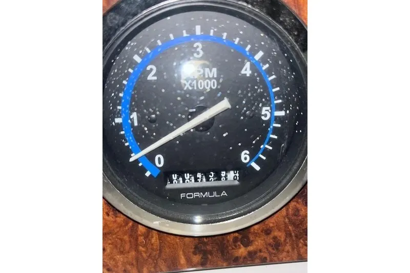 Slide: The Image of Tachometer of 2004 Formula 34 Performance Cruiser, displaying RPM in thousands. - 37