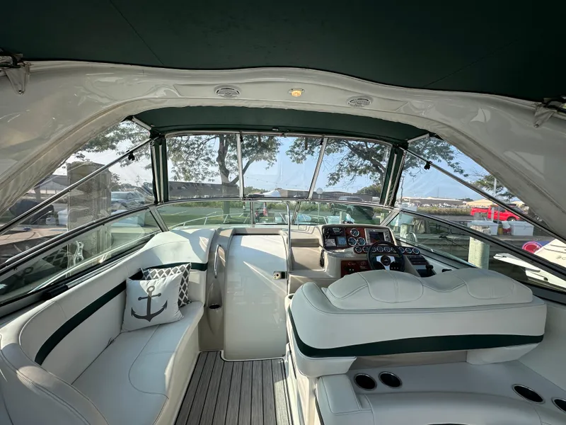 Slide: The Image of 2004 Formula 34 PC yacht interior with sleek white seating and modern design. - 6