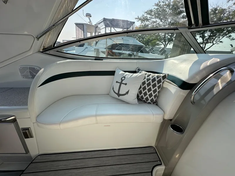 Slide: The Image of 2004 Formula 34 PC yacht interior with cushioned seating and nautical-themed decor. - 7