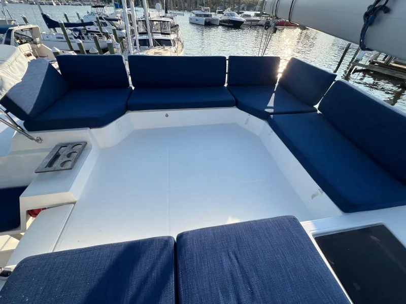 Slide: The Image of Spacious seating area on 2020 Fountaine Pajot Elba 45 catamaran, docked at marina. - 11