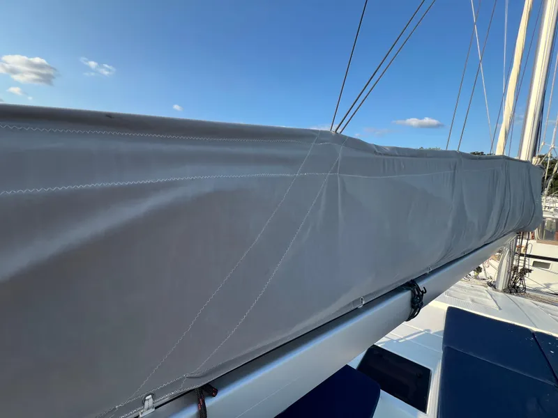 Slide: The Image of Fountaine Pajot Elba 45 sailboat boom cover, 2020 model, under clear blue sky. - 12