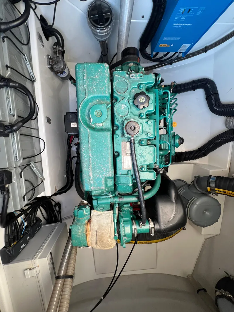 Slide: The Image of Engine compartment of a 2020 Fountaine Pajot Elba 45 catamaran, featuring a green marine engine. - 16