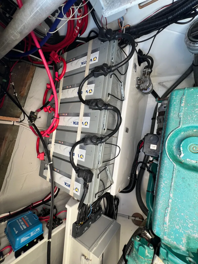 Slide: The Image of Engine room of 2020 Fountaine Pajot Elba 45 with batteries and wiring. - 17