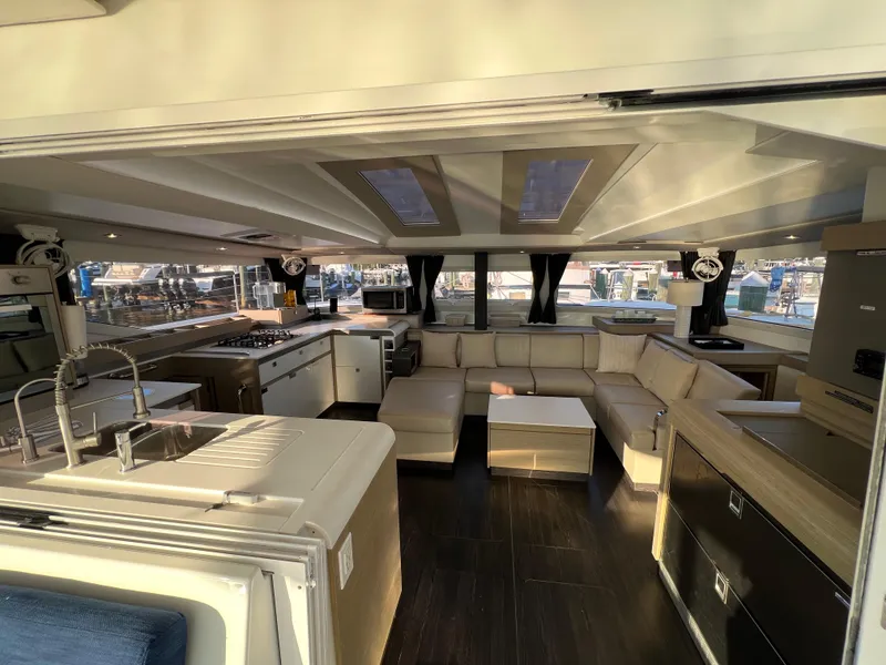 Slide: The Image of Luxurious interior of 2020 Fountaine Pajot Elba 45 catamaran with modern kitchen and seating area. - 22