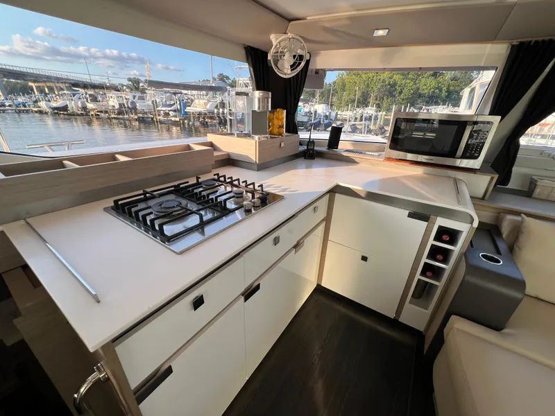 Slide: The Image of Modern kitchen interior of 2020 Fountaine Pajot Elba 45 yacht with stove and microwave. - 27