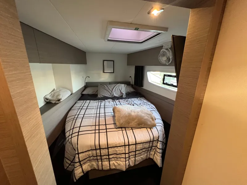 Slide: The Image of Cozy bedroom in 2020 Fountaine Pajot Elba 45 catamaran with modern decor and natural light. - 31