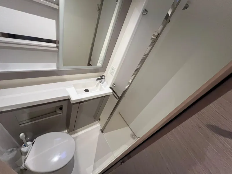 Slide: The Image of Modern bathroom in 2020 Fountaine Pajot Elba 45 yacht with shower, sink, and toilet. - 32
