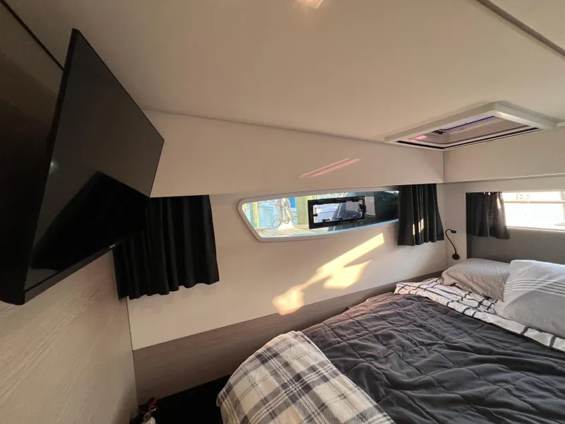 Slide: The Image of Cozy bedroom in 2020 Fountaine Pajot Elba 45 catamaran with TV and window view. - 35