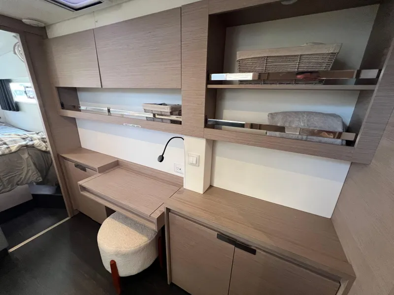 Slide: The Image of 2020 Fountaine Pajot Elba 45 interior with modern wooden cabinetry and workspace. - 40