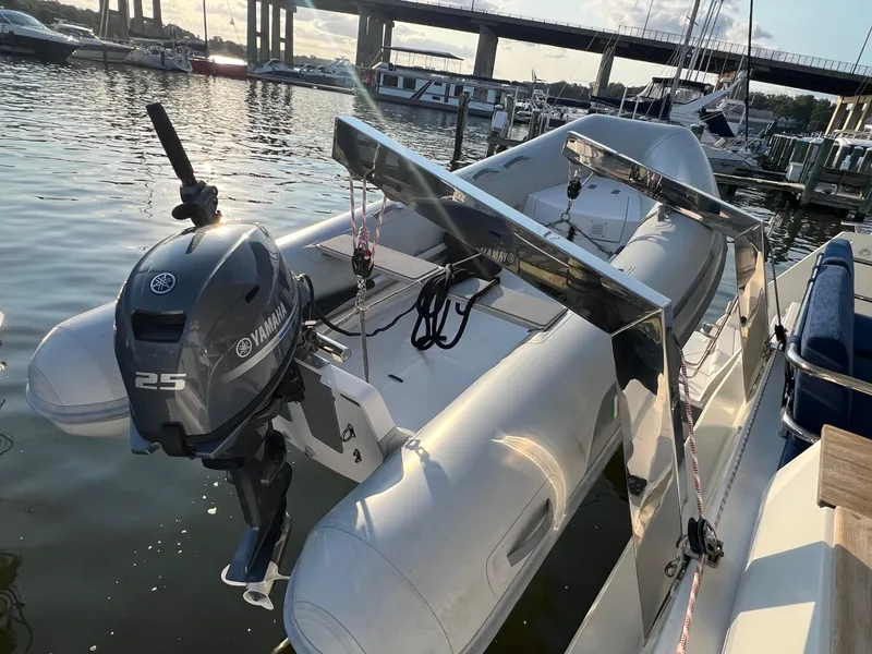 Slide: The Image of A 2020 Fountaine Pajot Elba 45 with Yamaha 25 outboard motor docked at a marina. - 5