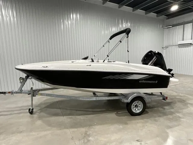 Slide: The Image of 2025 Bayliner Element E16 boat on trailer in indoor storage. - 1