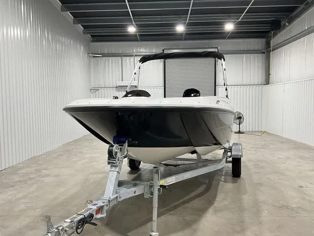 Slide: The Image of 2025 Bayliner Element E16 boat in storage, front view on trailer. - 2