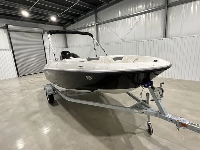 Slide: The Image of 2025 Bayliner Element E16 boat on trailer in a garage. - 3