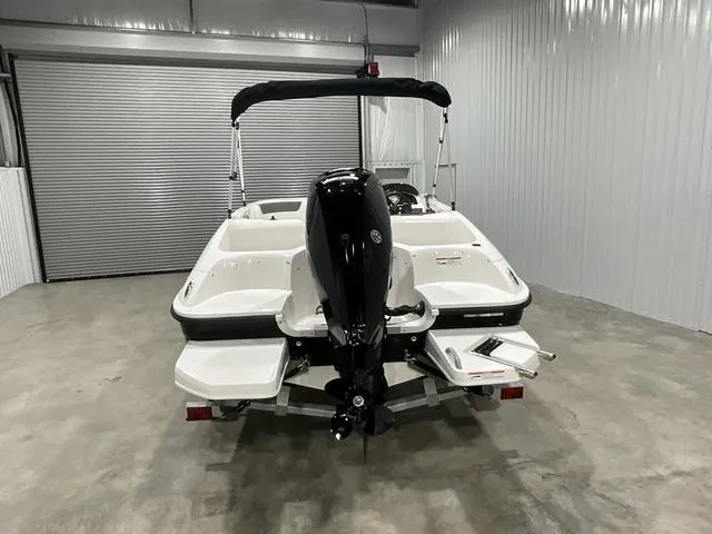 Slide: The Image of 2025 Bayliner Element E16 boat in storage, rear view with outboard motor. - 5