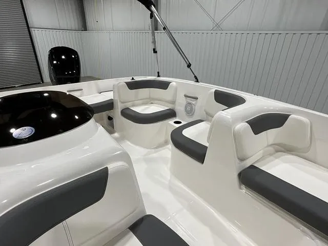 Slide: The Image of 2025 Bayliner Element E16 boat interior with sleek seating and modern design. - 6