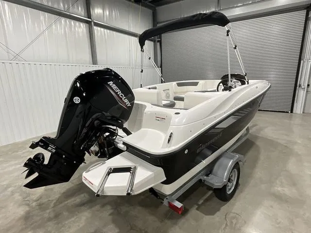 Slide: The Image of 2025 Bayliner Element E16 boat with Mercury engine in a showroom. - 7
