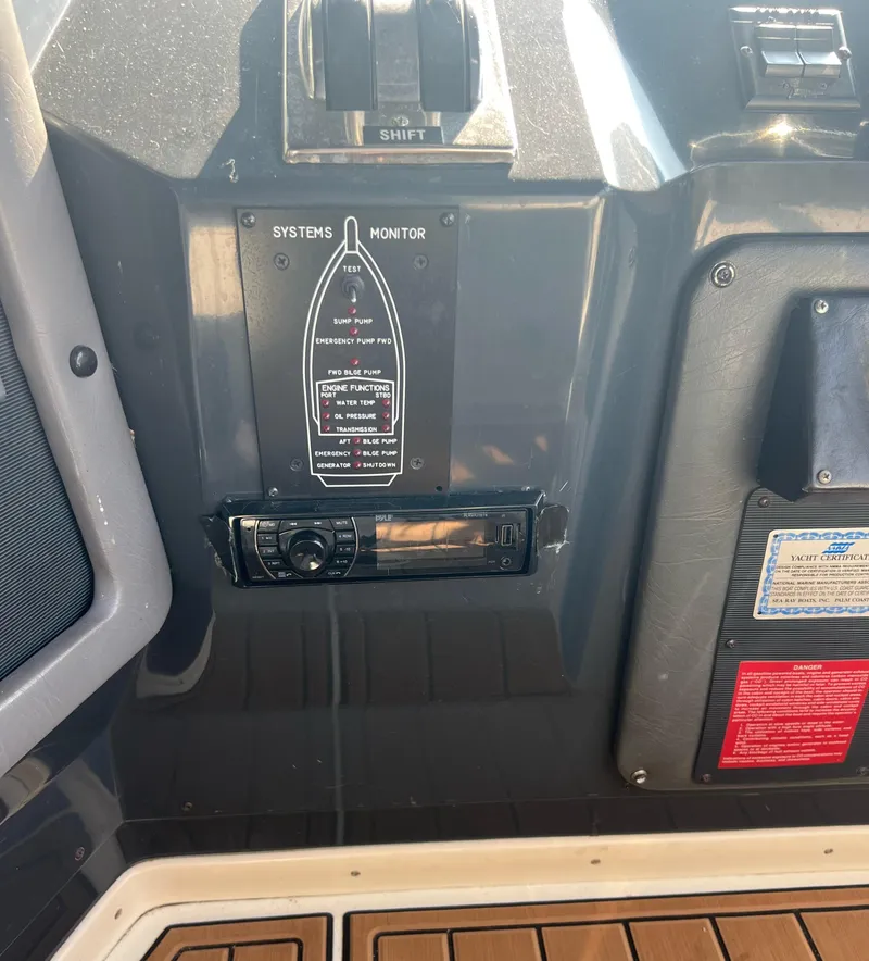 Slide: The Image of Control panel of a 1990 Sea Ray 420 Sundancer boat. - 16