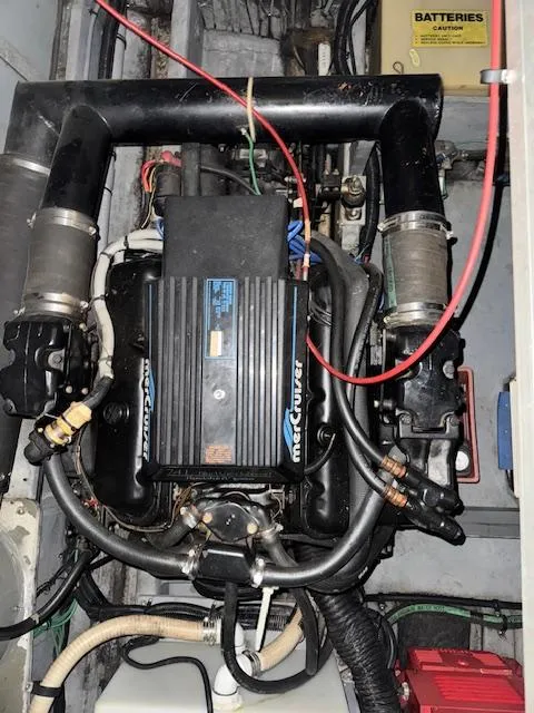 Slide: The Image of Engine compartment of a 1990 Sea Ray 420 Sundancer with MerCruiser components. - 22
