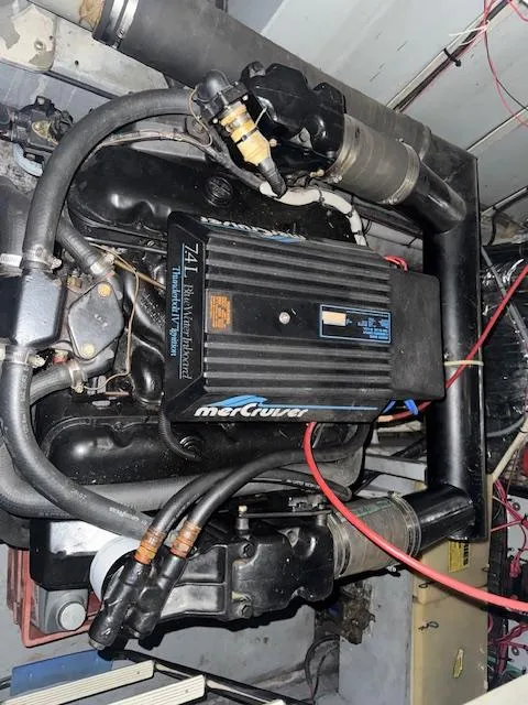 Slide: The Image of Engine of 1990 Sea Ray 420 Sundancer with MerCruiser components. - 23