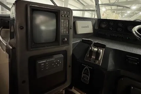 Slide: The Image of Control panel of a 1990 Sea Ray 420 Sundancer boat with navigation equipment. - 29
