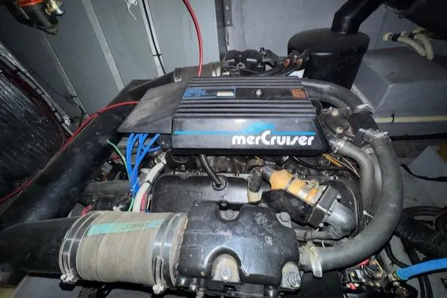 Slide: The Image of Engine of a 1990 Sea Ray 420 Sundancer with MerCruiser components. - 31
