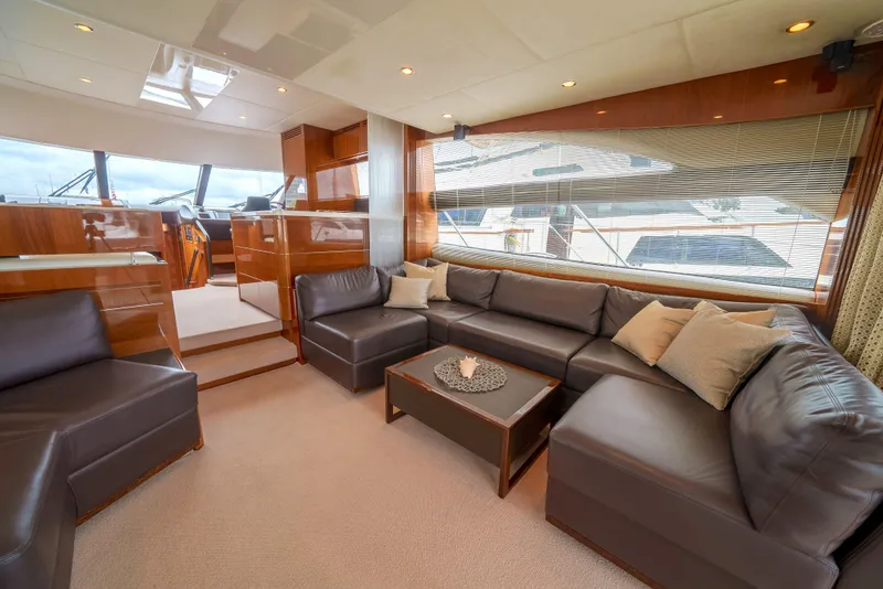 Slide: The Image of Luxurious interior of 2012 Princess Flybridge 60 Motor Yacht with leather seating and elegant decor. - 10