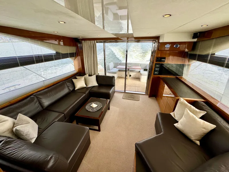 Slide: The Image of Luxurious interior of 2012 Princess Flybridge 60 Motor Yacht with leather seating and modern decor. - 14