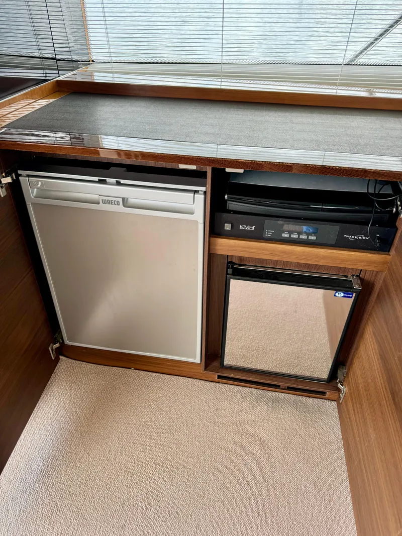 Slide: The Image of Interior of 2012 Princess Flybridge 60 Yacht with fridge and appliances. - 16