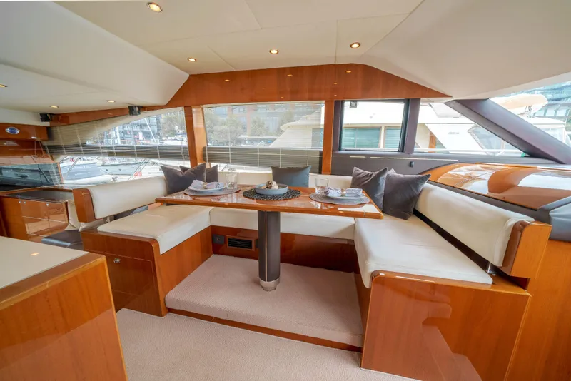 Slide: The Image of Luxurious interior of 2012 Princess Flybridge 60 Motor Yacht with elegant dining area. - 20
