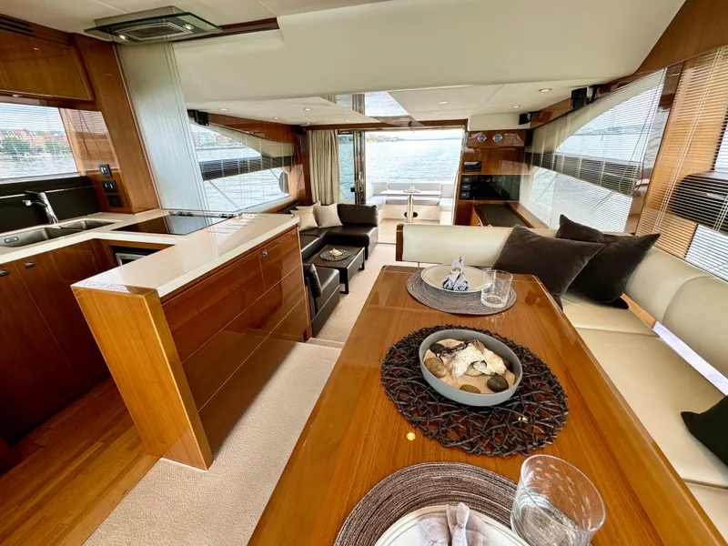 Slide: The Image of Luxurious interior of 2012 Princess Flybridge 60 Motor Yacht with elegant dining and seating area. - 21