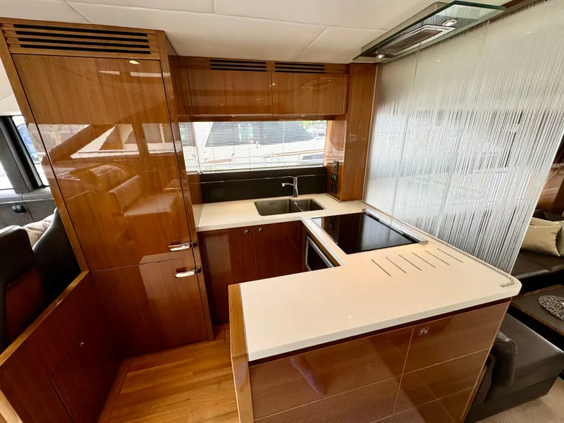 Slide: The Image of Luxurious kitchen interior of 2012 Princess Flybridge 60 Motor Yacht with modern amenities. - 28